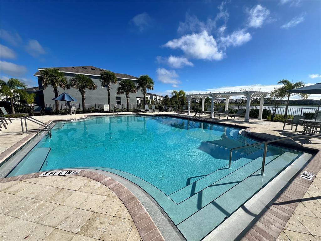 110 Mangrove Shade Circle Apollo Beach, FL 33572 - Photo 33 of 36 a view of a swimming pool from a balcony