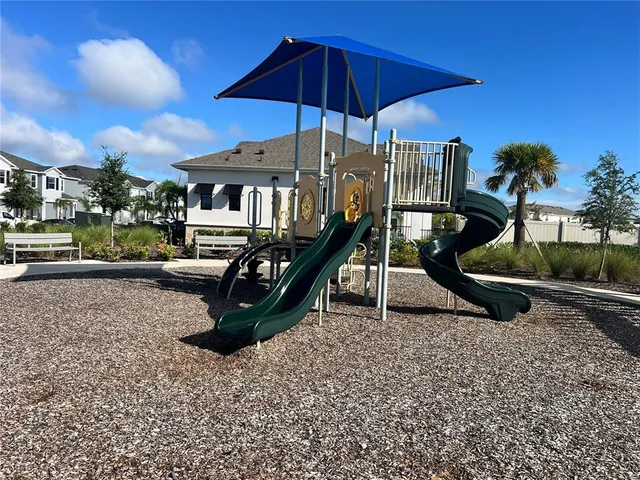 a view of a house with a yard porch and sitting area