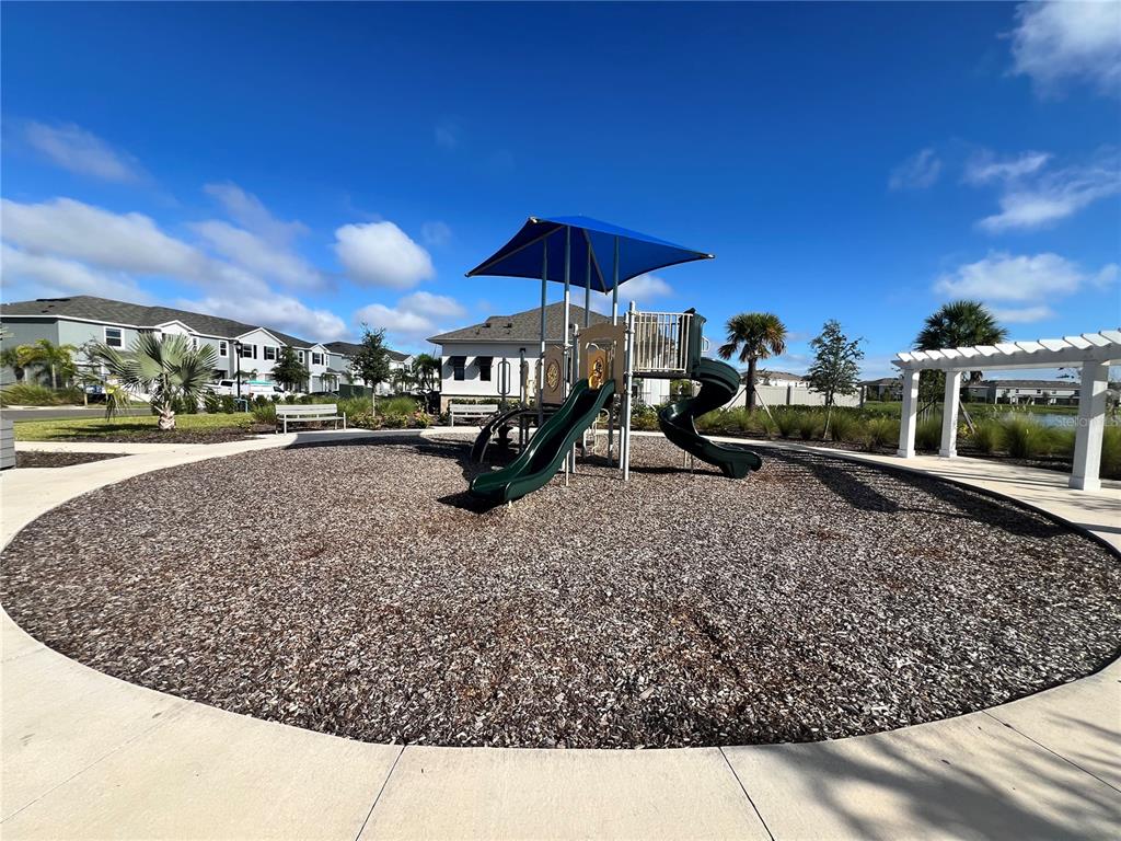 110 Mangrove Shade Circle Apollo Beach, FL 33572 - Photo 35 of 36 a view of a house with a yard porch and sitting area