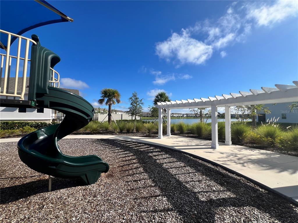 110 Mangrove Shade Circle Apollo Beach, FL 33572 - Photo 36 of 36 a house view with a sitting space fire pit and outdoor space