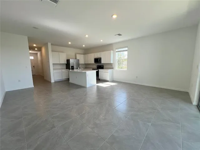a view of a kitchen and dining room cabinets