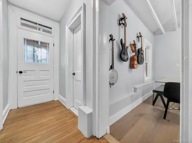 a view of a workspace with furniture and wooden floor
