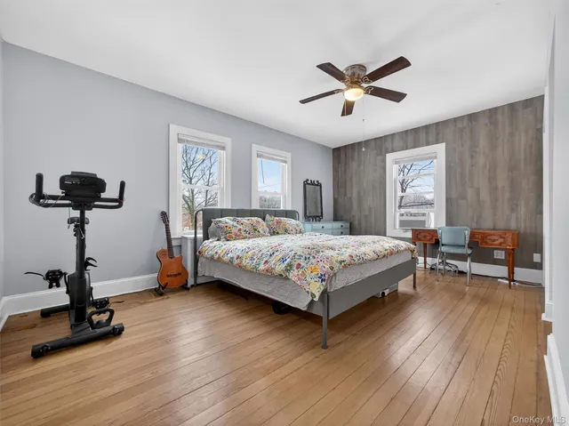 a bedroom with a bed and a chair