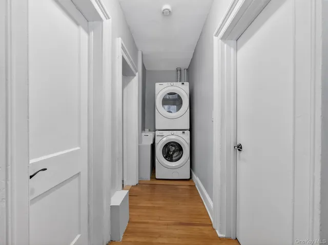 a view of a hallway with washer and dryer