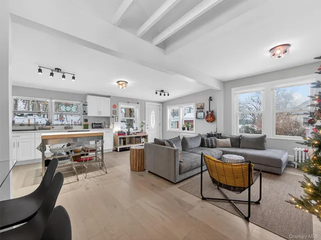 a view of a dining room with furniture and toys