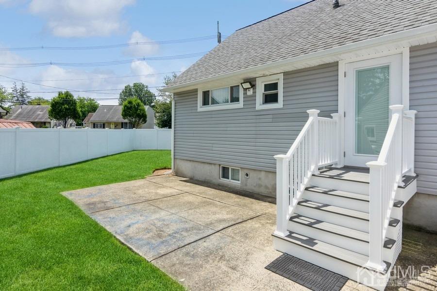 2 Colonial Road Roselle, NJ 07203 - Photo 3 of 17 a view of a house with backyard and wooden fence