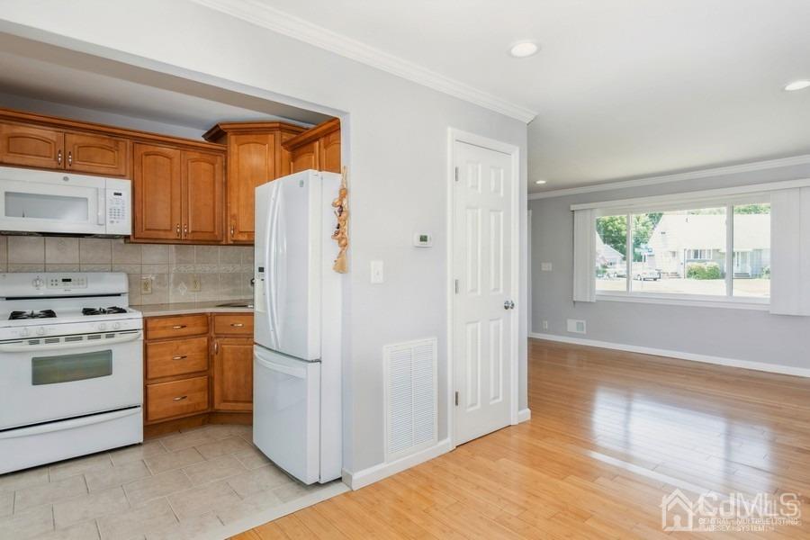 2 Colonial Road Roselle, NJ 07203 - Photo 8 of 17 a kitchen with a refrigerator stove and sink