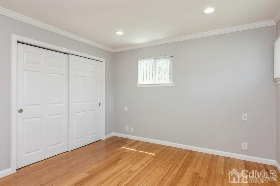 2 Colonial Road Roselle, NJ 07203 - Photo 10 of 17 wooden floor in an empty room with a window