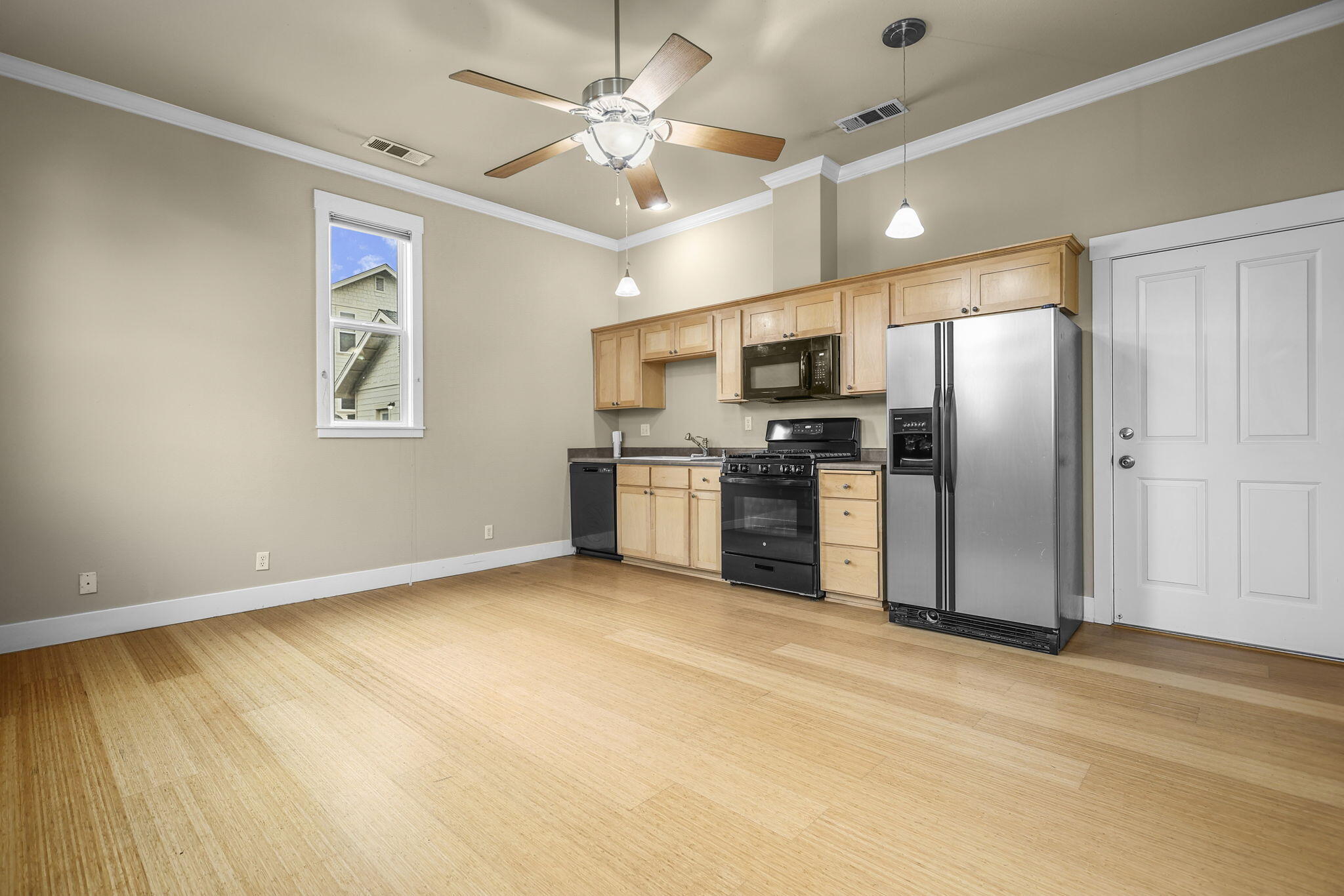 864 Kite Lane Redding, CA 96001 - Photo 12 of 18 a view of a kitchen with a sink stainless steel appliances wooden floor and a window