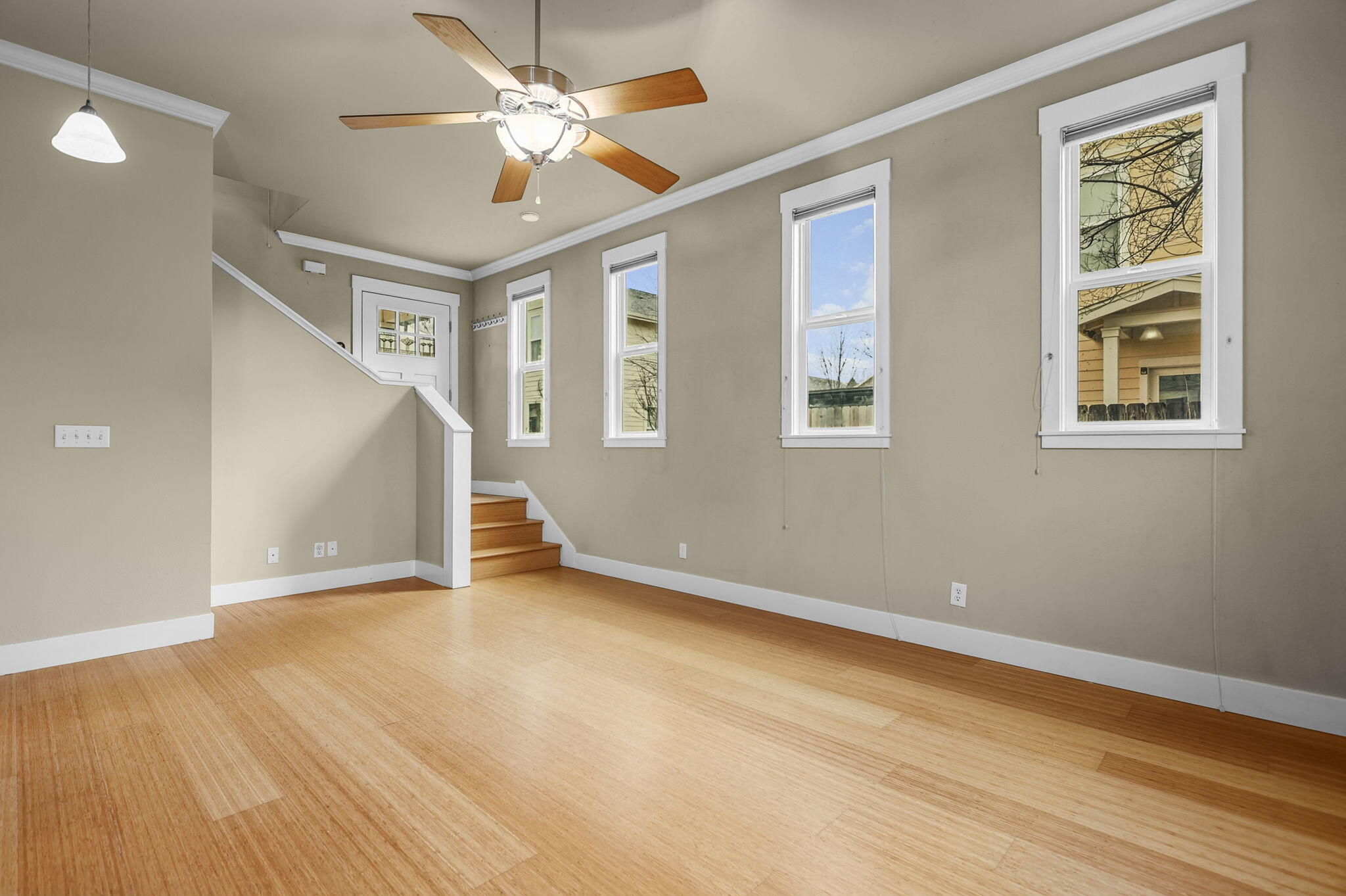 864 Kite Lane Redding, CA 96001 - Photo 2 of 18 a view of an empty room with wooden floor and a window