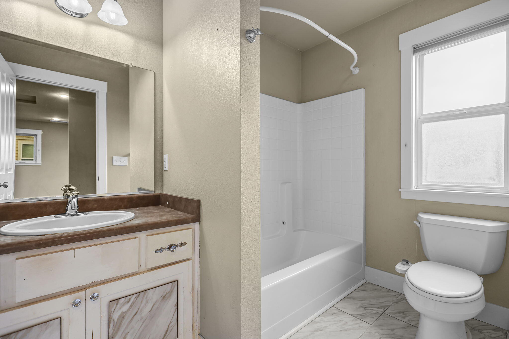 864 Kite Lane Redding, CA 96001 - Photo 10 of 18 a bathroom with a granite countertop sink toilet and shower