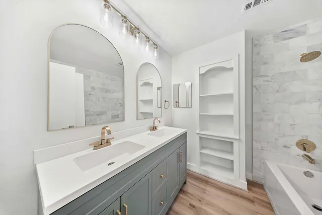 a bathroom with a sink and a bathtub