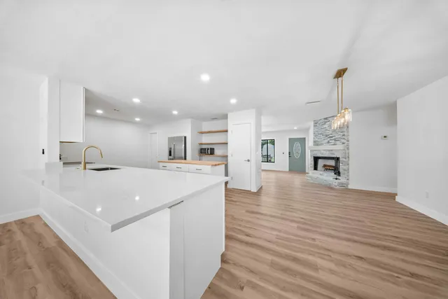a view of kitchen with cabinets and wooden floor