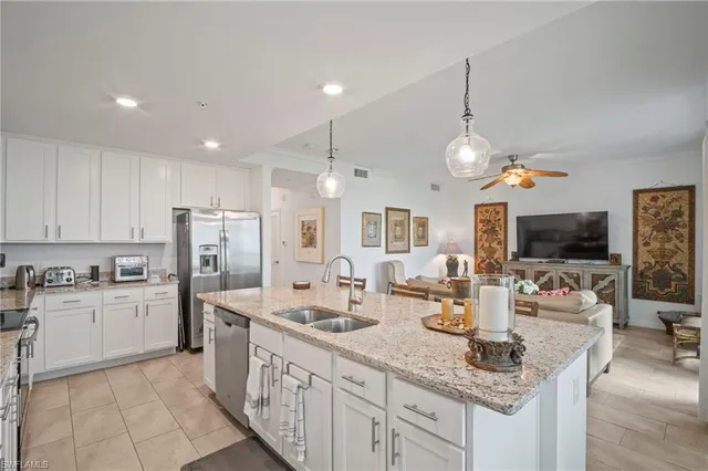 a kitchen with granite countertop living room and living room