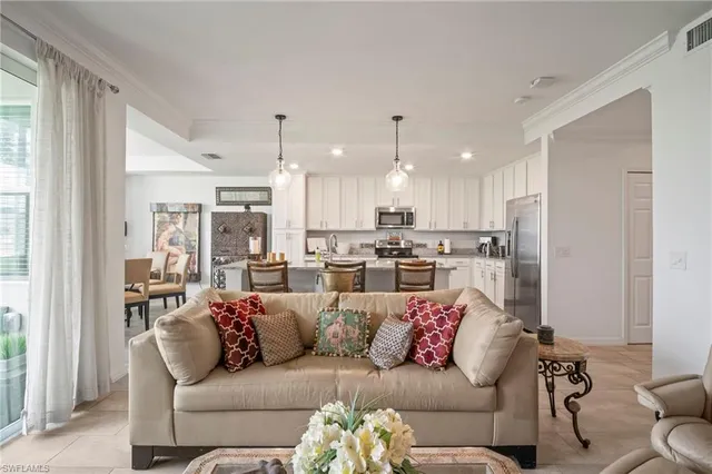 a view of a living room kitchen and a window