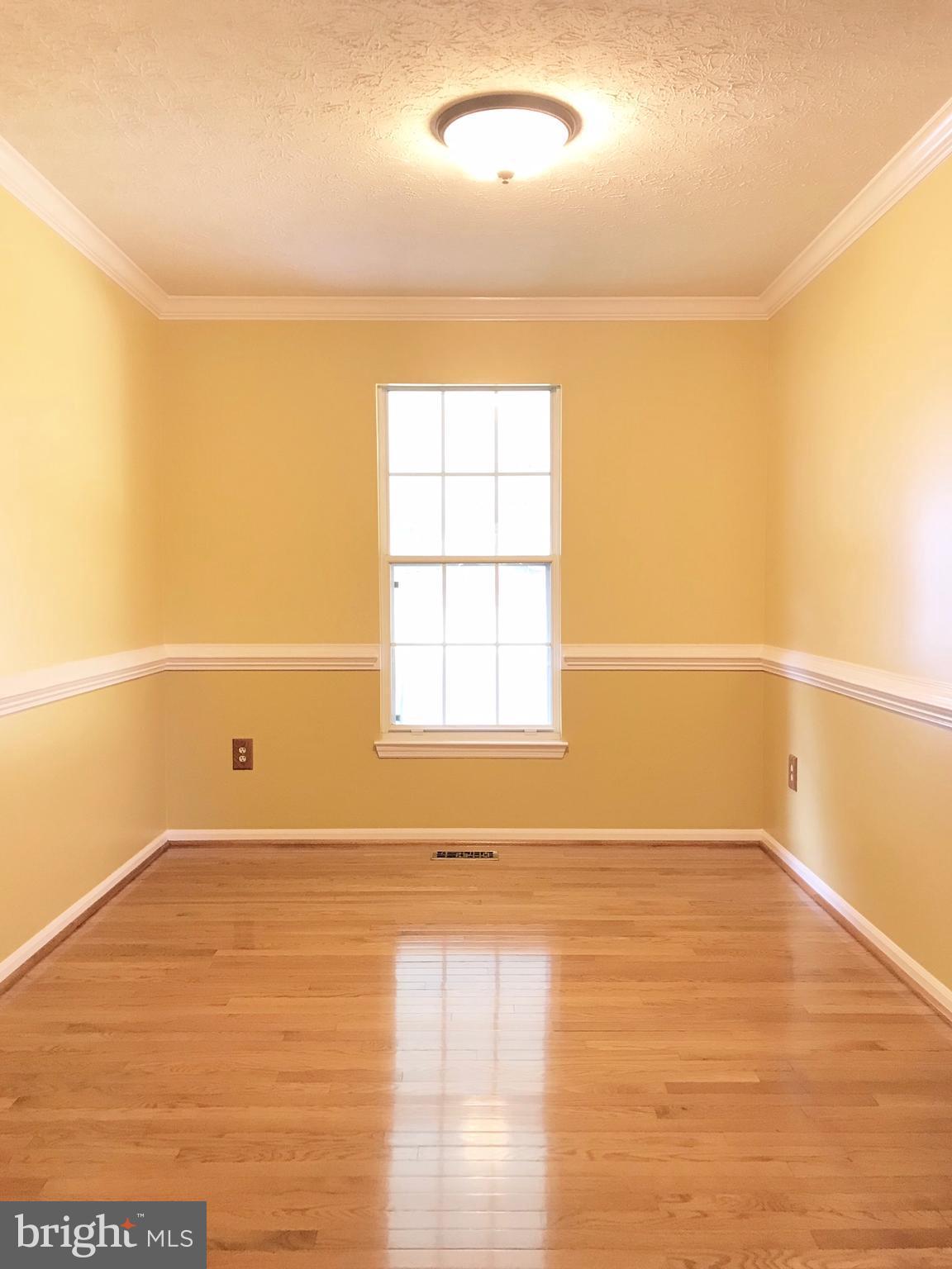 8703 Ridgelys Choice Drive Baltimore, MD 21236 - Photo 5 of 30 Real hardwood floors, crown and chair railing
