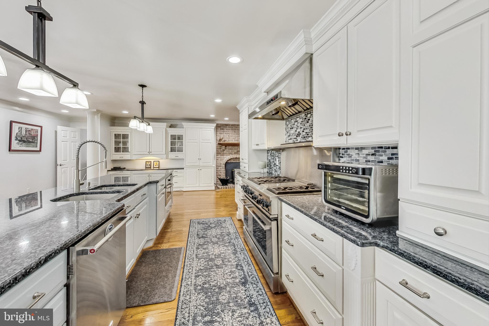 14611 Manor Road Phoenix, MD 21131 - Photo 16 of 85 a large kitchen with stainless steel appliances granite countertop a stove and a sink