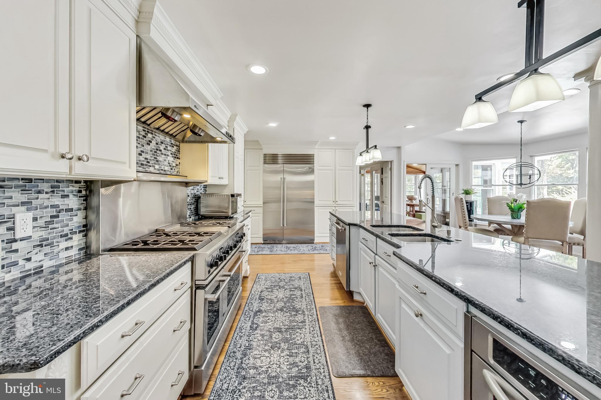14611 Manor Road Phoenix, MD 21131 - Photo 17 of 85 a large kitchen with stainless steel appliances granite countertop a lot of counter space and wooden floors