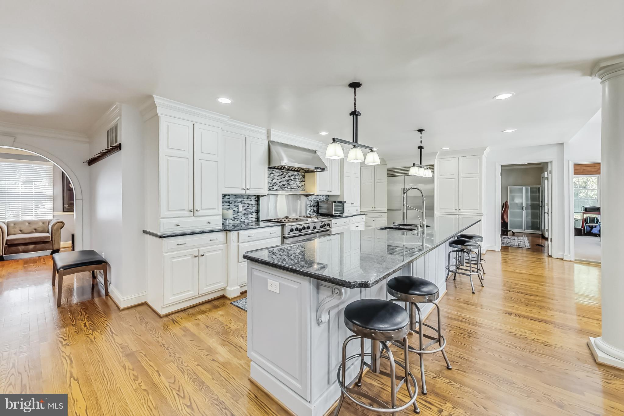 14611 Manor Road Phoenix, MD 21131 - Photo 18 of 85 a kitchen with stainless steel appliances kitchen island granite countertop a sink and cabinets