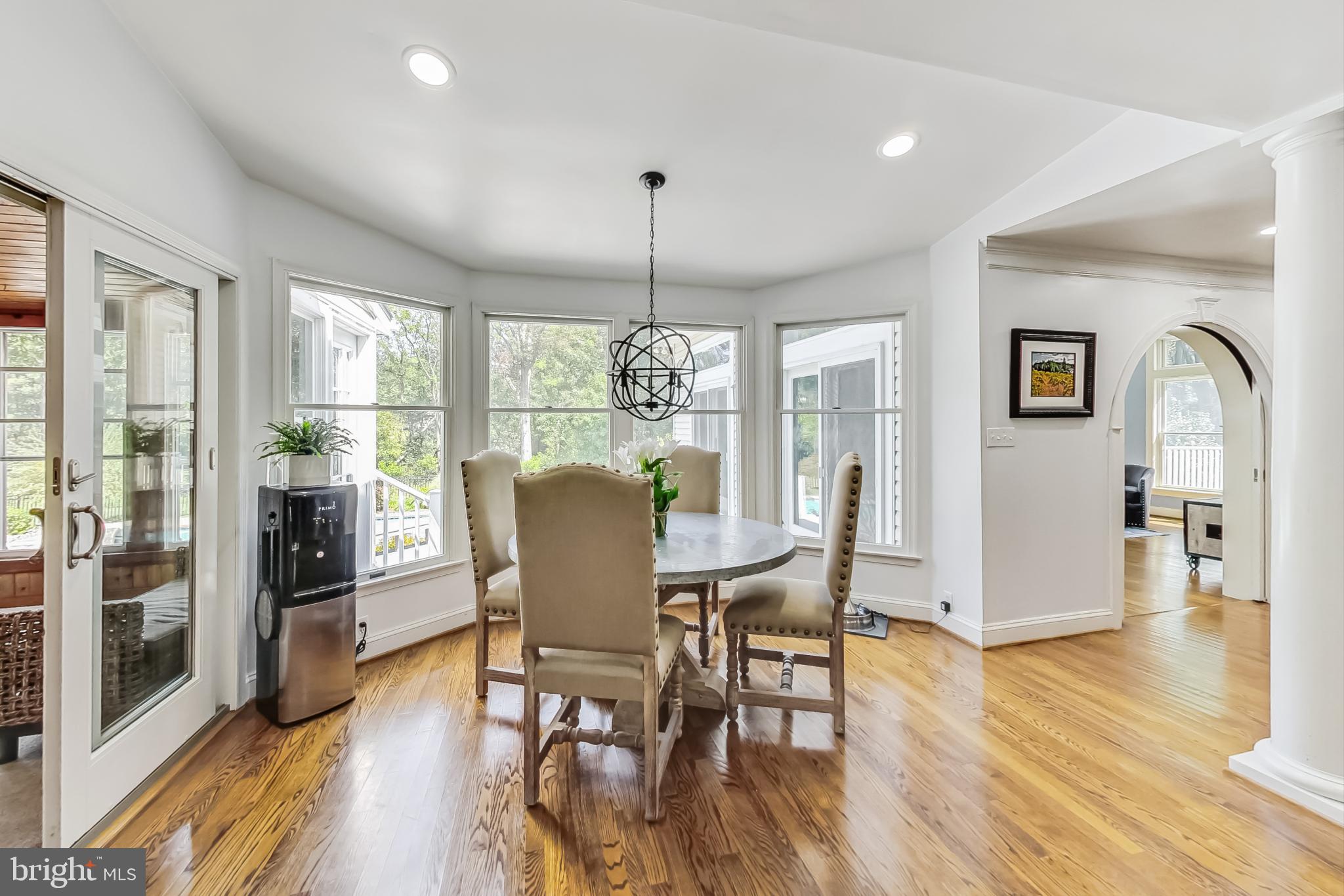 14611 Manor Road Phoenix, MD 21131 - Photo 20 of 85 a dining room with furniture a chandelier and wooden floor