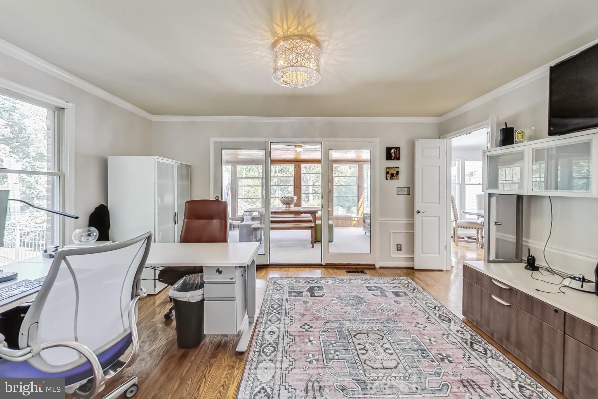 14611 Manor Road Phoenix, MD 21131 - Photo 29 of 85 a living room with furniture a flat screen tv and a fireplace