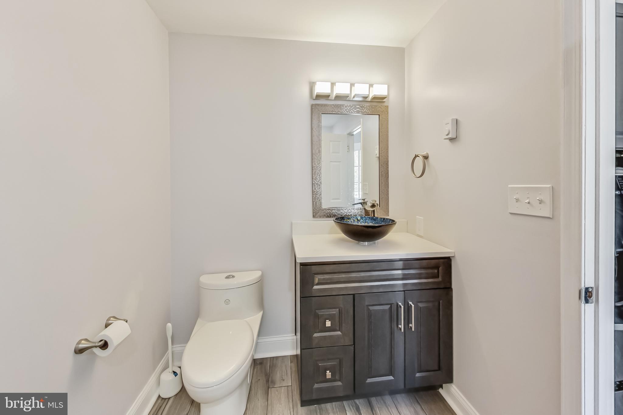 14611 Manor Road Phoenix, MD 21131 - Photo 31 of 85 a living room with a toilet and a sink