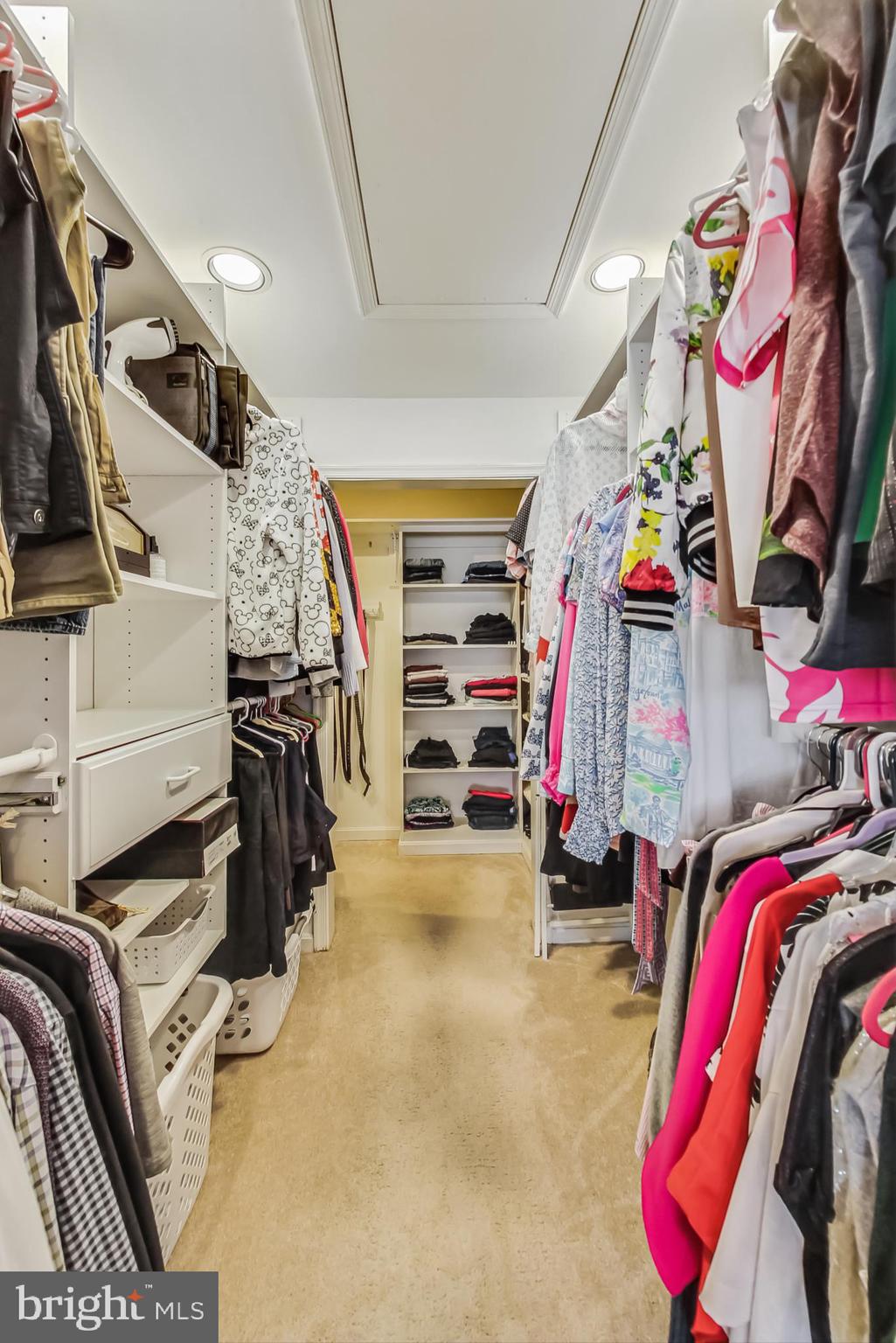 14611 Manor Road Phoenix, MD 21131 - Photo 36 of 85 a view of walk in closet with clothes and shoes