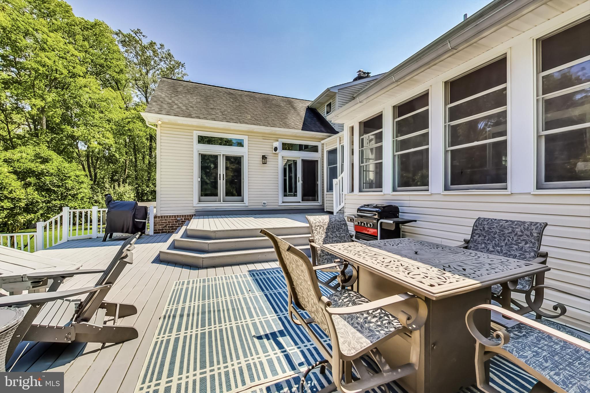14611 Manor Road Phoenix, MD 21131 - Photo 59 of 85 a view of a patio with table and chairs with wooden floor and fence