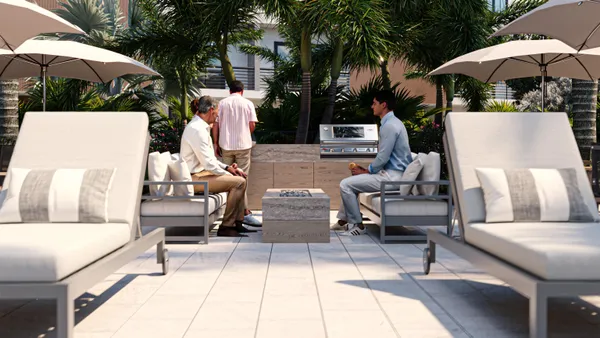 a view of outdoor sitting area with furniture and umbrella