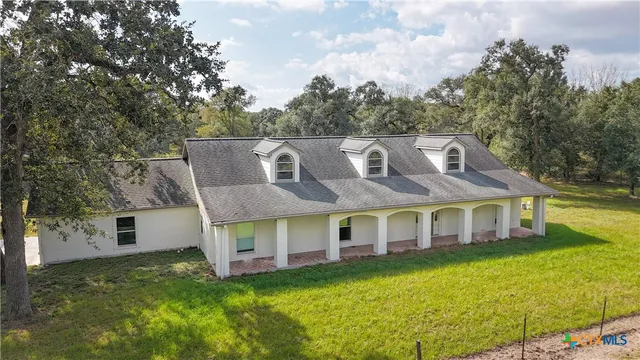a view of a lake with a yard