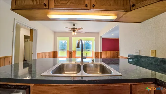 a kitchen with a sink and a window