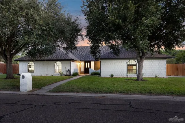 a front view of a house with garage