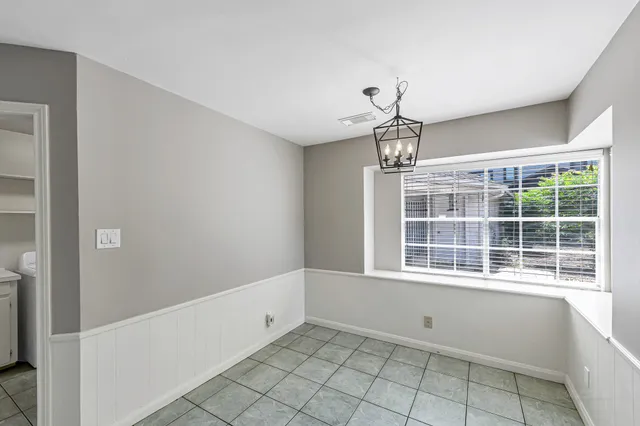 a view of empty room with windows