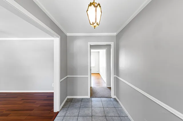 a view of an entryway with wooden floor