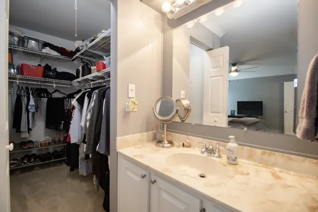 a view of a bathroom with a sink and mirror
