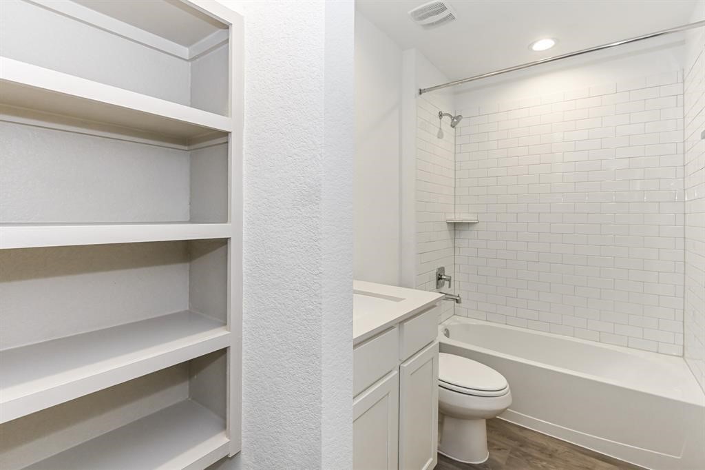 226 Serena Park Lane Rosharon, TX 77583 - Photo 5 of 19 a bathroom with a toilet sink and shower