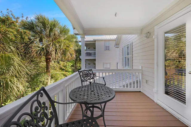 a bedroom with two beds and a lamp