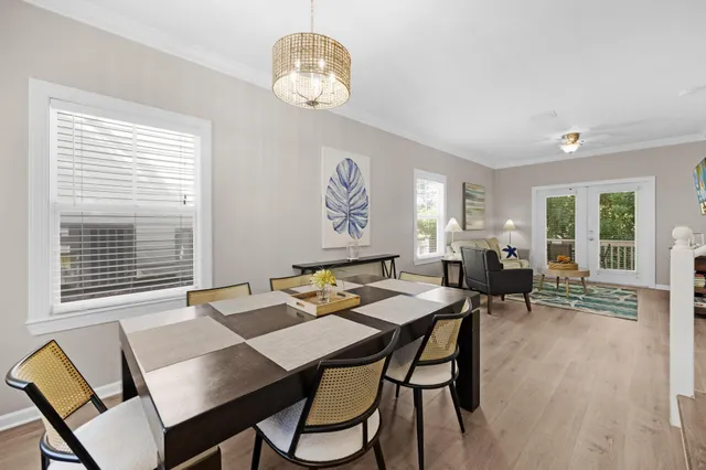 a view of a dining room furniture and window