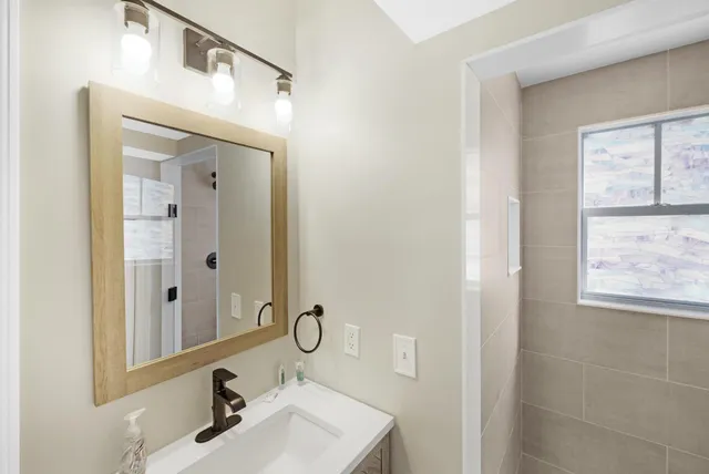 a kitchen with a sink and window