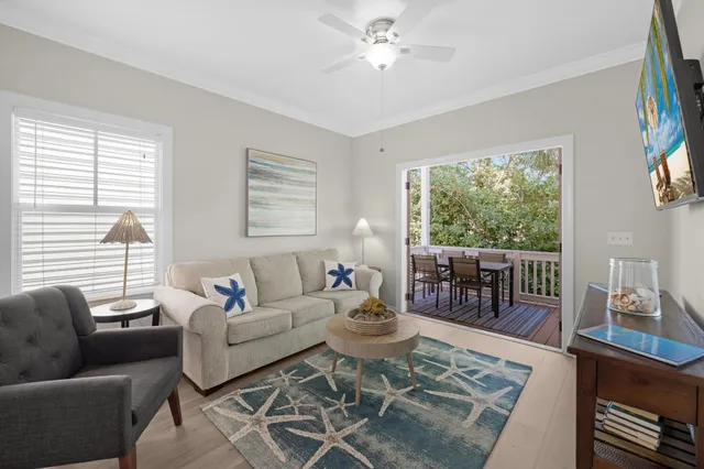 an aerial view of a residential houses with yard