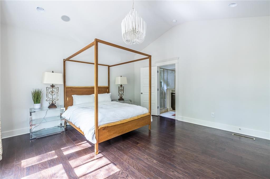 1005 Braeburn Lane Decatur, GA 30030 - Photo 17 of 25 a bedroom with a bed and a mirror