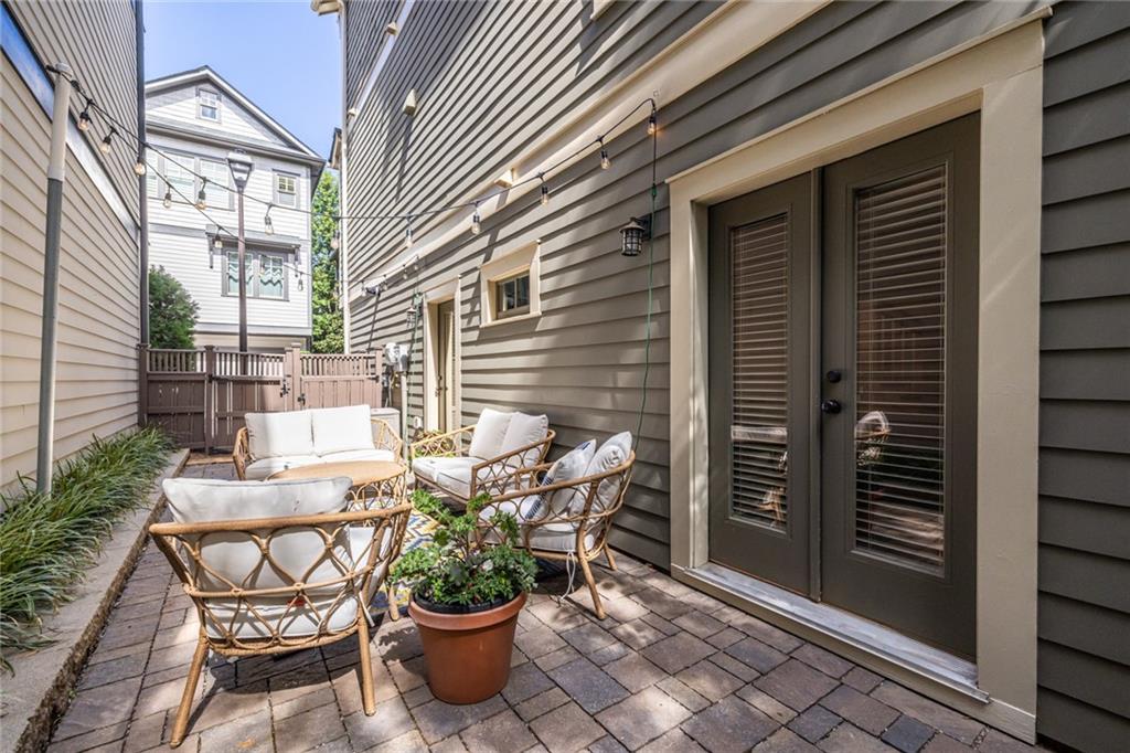1005 Braeburn Lane Decatur, GA 30030 - Photo 22 of 25 a view of a balcony with table and chairs and potted plants
