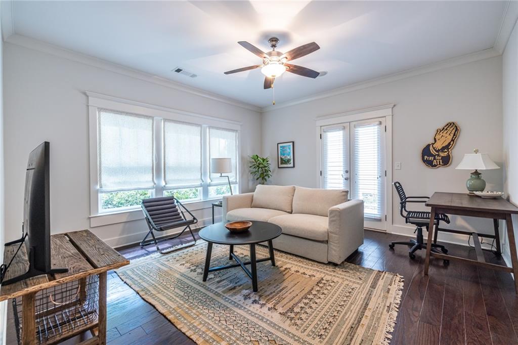 1005 Braeburn Lane Decatur, GA 30030 - Photo 5 of 25 a living room with furniture a rug and a flat screen tv