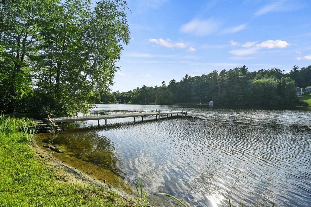 60 Lincoln Point Road Charlton, MA 01507 - Photo 1 of 42 a view of a swimming pool with a yard