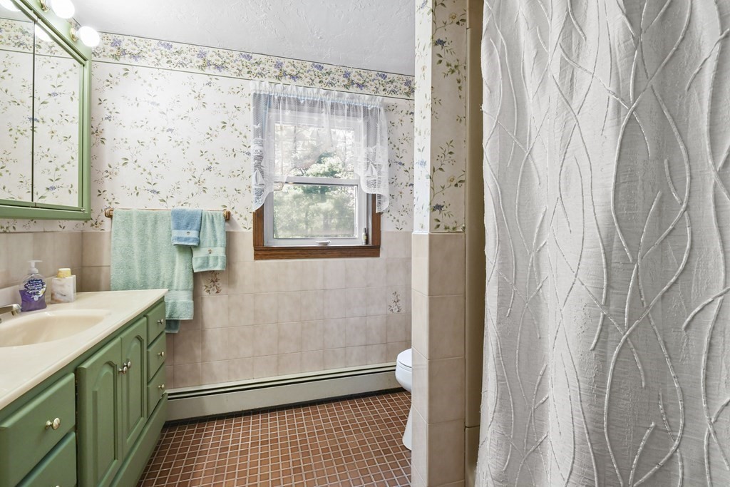 60 Lincoln Point Road Charlton, MA 01507 - Photo 25 of 42 a bathroom with a sink and a mirror