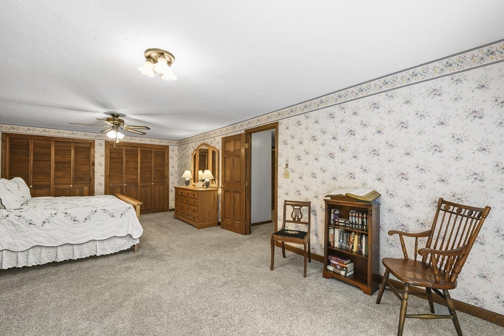 60 Lincoln Point Road Charlton, MA 01507 - Photo 28 of 42 a spacious bedroom with a bed and a table