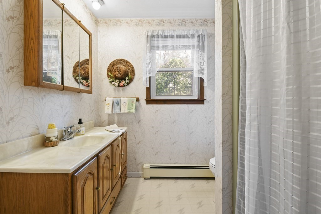 60 Lincoln Point Road Charlton, MA 01507 - Photo 29 of 42 a bathroom with a sink and a mirror