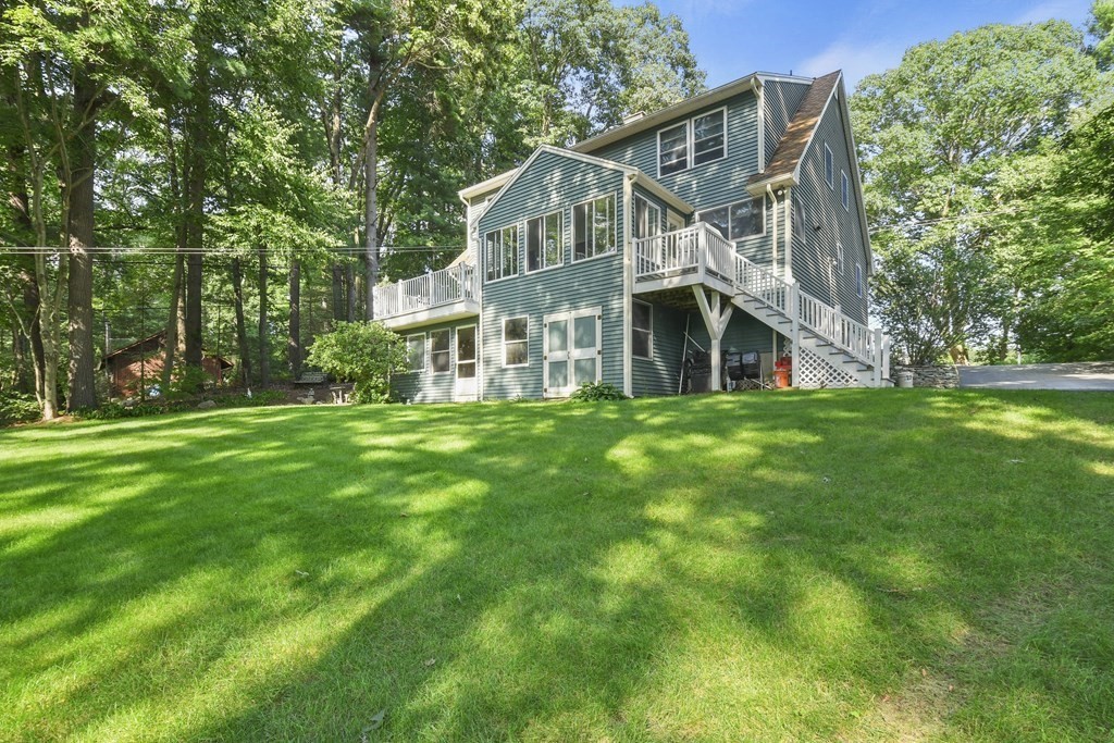 60 Lincoln Point Road Charlton, MA 01507 - Photo 38 of 42 a view of a house with a yard