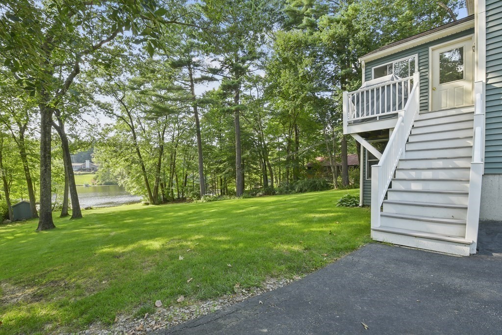 60 Lincoln Point Road Charlton, MA 01507 - Photo 39 of 42 a view of a house with a backyard