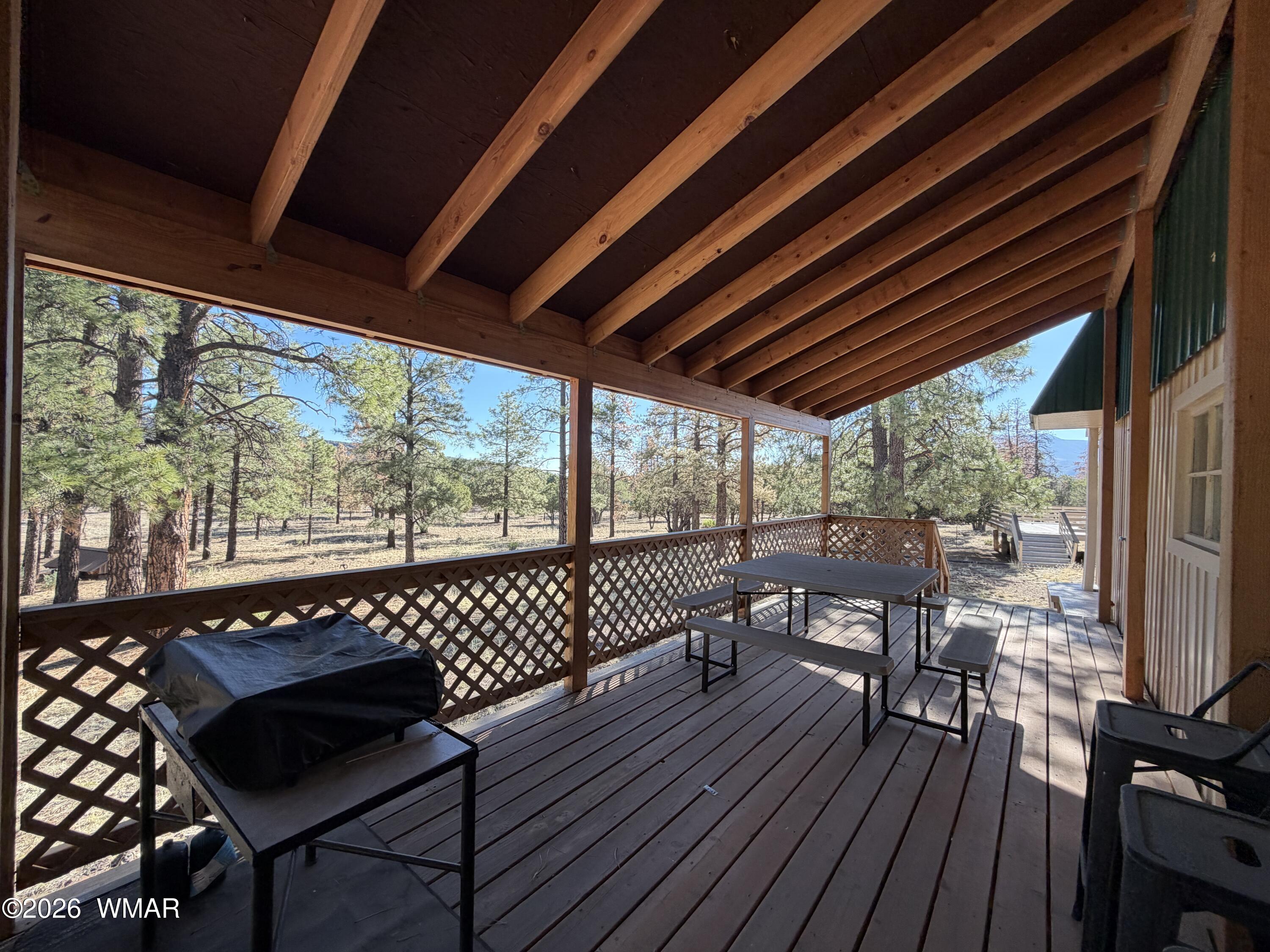 19 County Road Show Low, AZ 85901 - Photo 28 of 43 a view of a patio with wooden floor chairs and a table